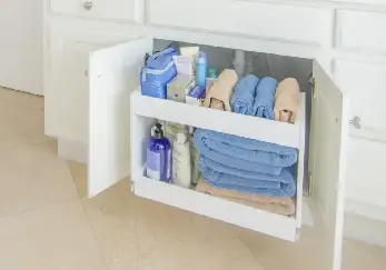 Towels under the bathroom cabinet.
