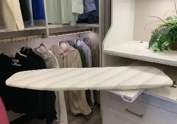 Ironing board in the closet.