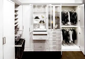 White closet with pull out drawers.