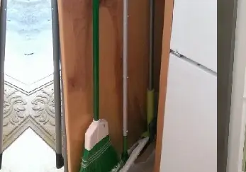 Pull-Out Broom Shelf.