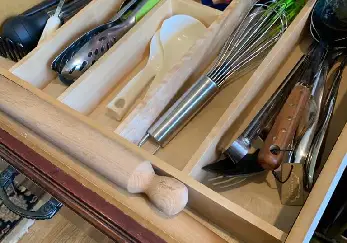 Drawer with utensils.
