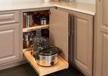 Pots and pans in cabinet drawer.