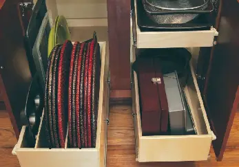Flat pans in a drawer.