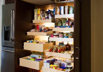 Cabinet pantry full of food.