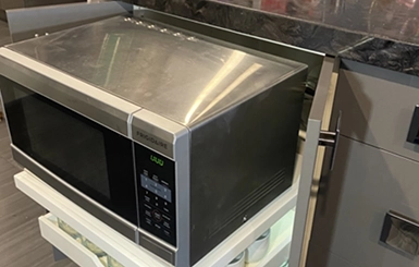 Custom shelving with a microwave.