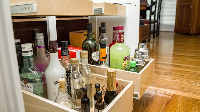 Organized liquor in a drawer.