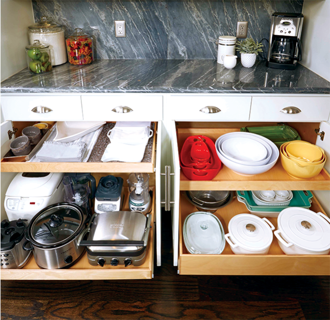 Pull out cabinet of kitchen items.