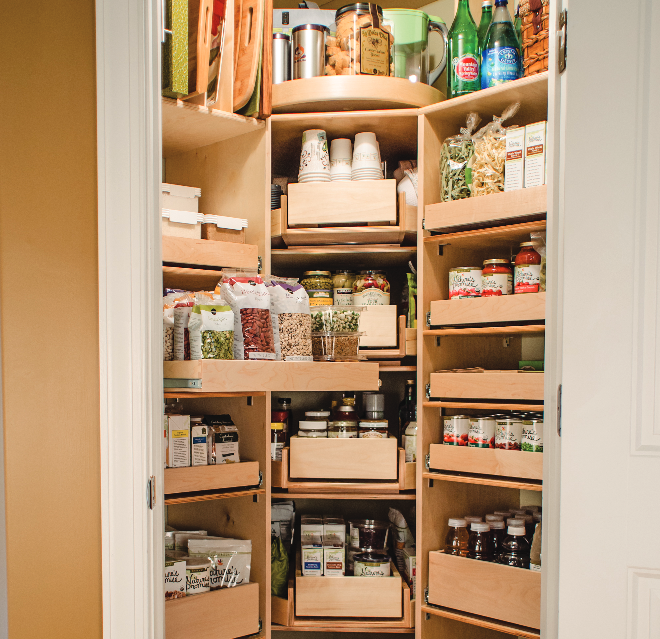 Pull-out shelves extending from a kitchen corner pantry.