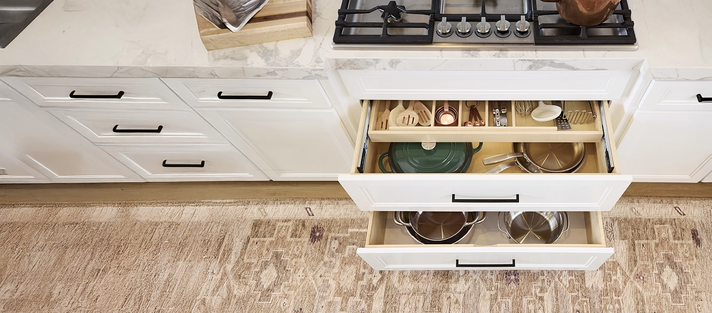 Pots and pans in pull out shelves.