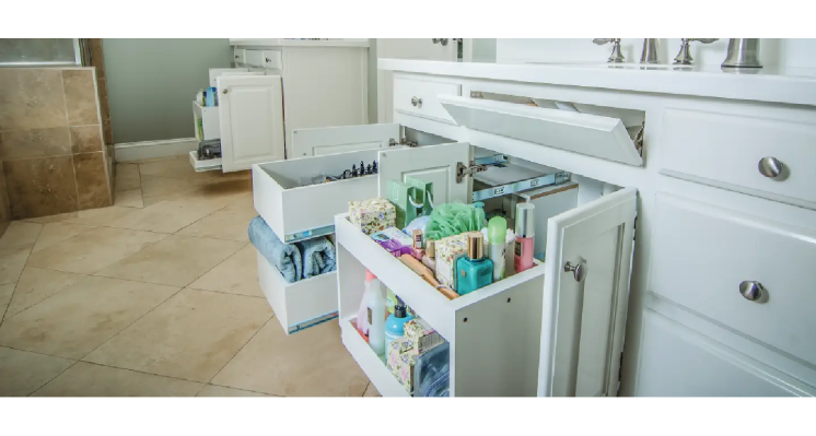 White bathroom with cabinet doors open. 