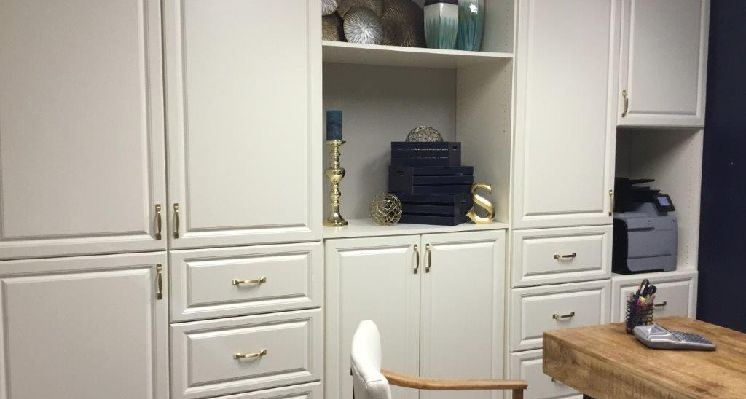 Office space with white cabinets.