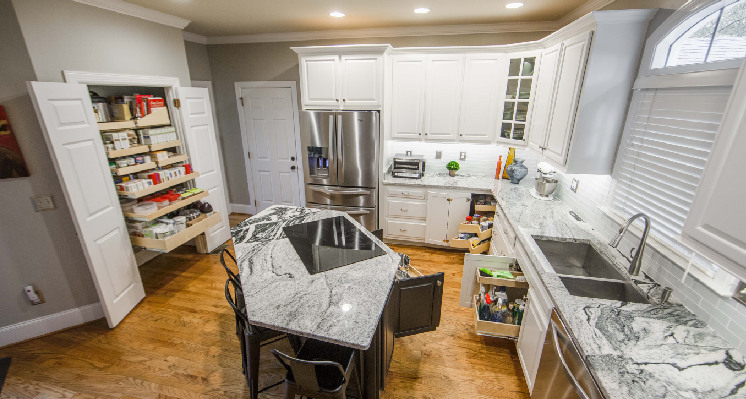 Pantry with wooden shelves full of items.