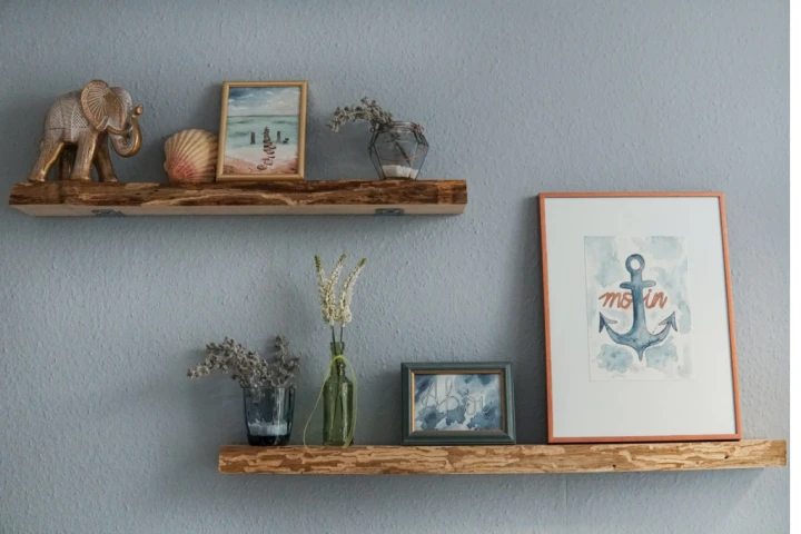 Wooden floating shelves with different display on it