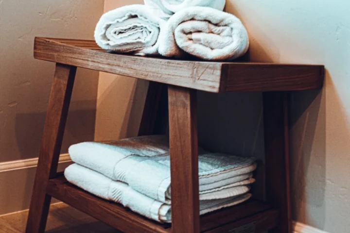  footstool holding white towels