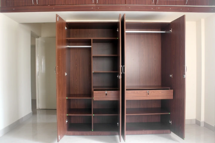 A freestanding wardrobe or other storage cabinet is great for workout equipment.