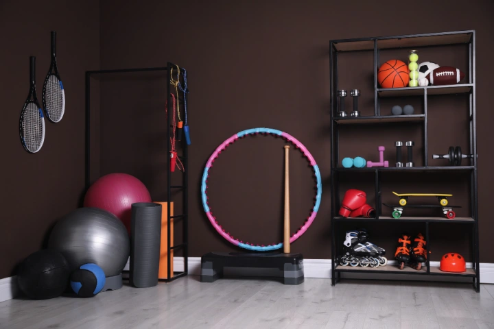 A repurposed piece of furniture is a great option for storing workout equipment in a home gym.