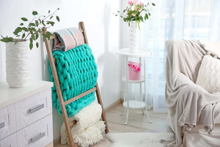  A blanket ladder is perfect to keep your coziest living accessories off of the couch and out of the way.