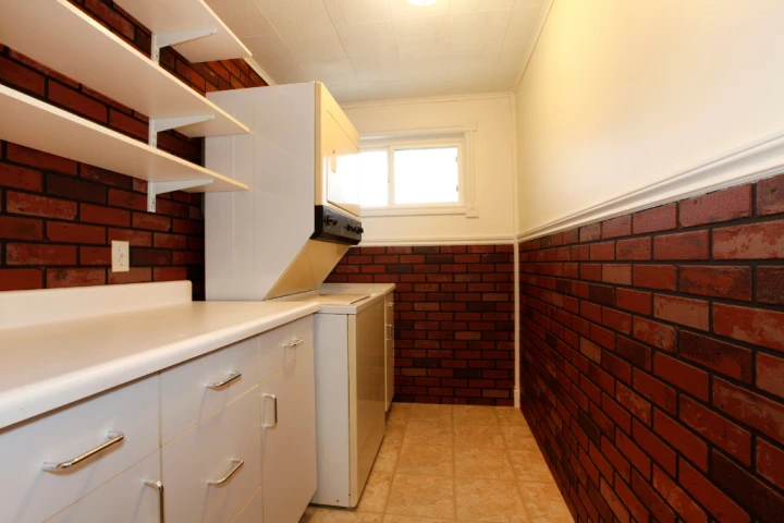 If your utility room isn't equipped with built-in shelving, custom-made shelves can appear as if they are built-in.