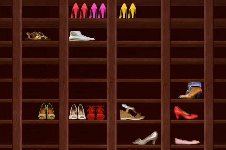 A vertical shoe rack with shoes.