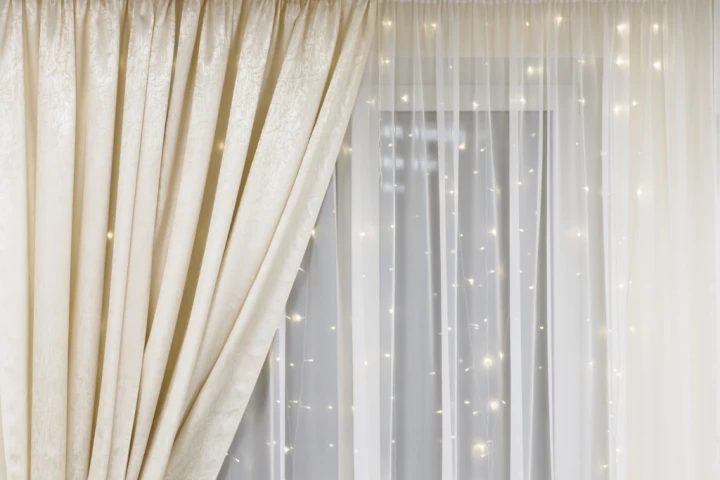 Sheers and a light wall give the appearance of open space and nighttime stars, bringing on all the cozy!
