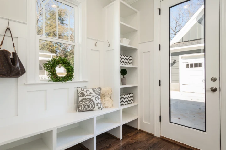 White entryway mudroom with cube wood shelves.