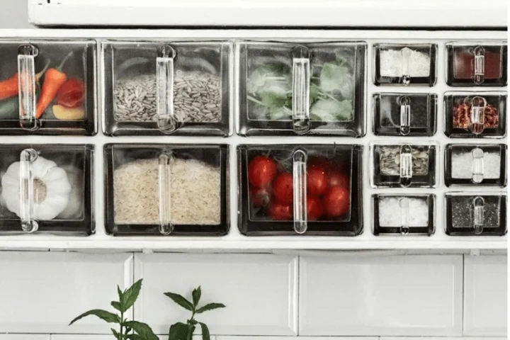 A drawer with different containers of food.