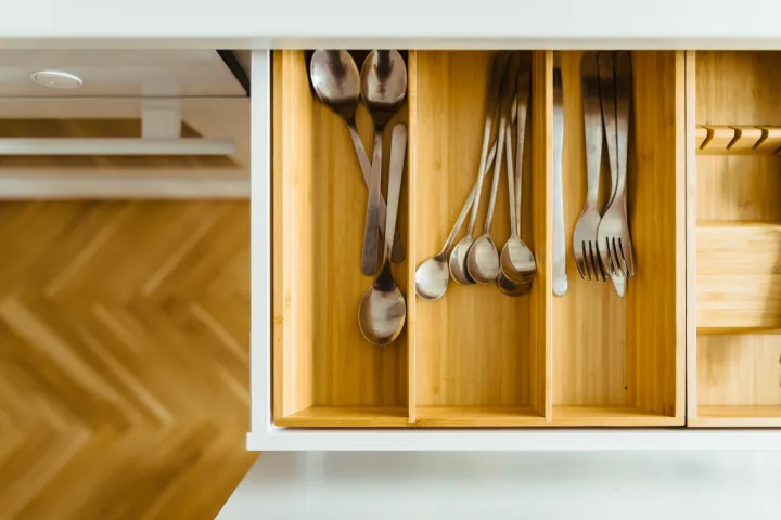 A drawer with silverware in it.