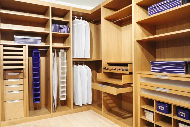 A large wooden closet with shelves and shelves.