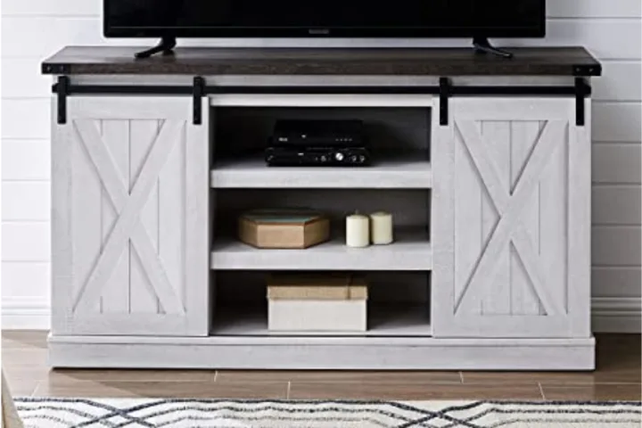 A tv stand with a sliding-door.