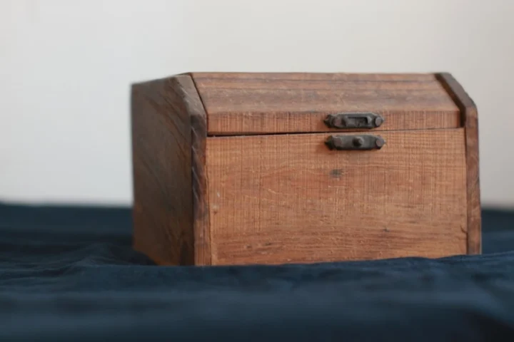 A wooden box with a lock.