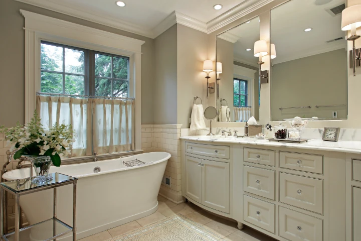 ictorian bathroom with white bureau and marble counter vanity set.