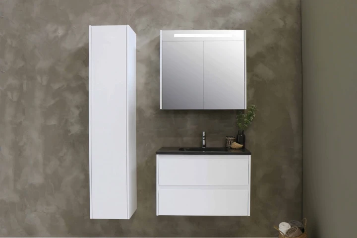 A bathroom with a sink and floating wall cabinet