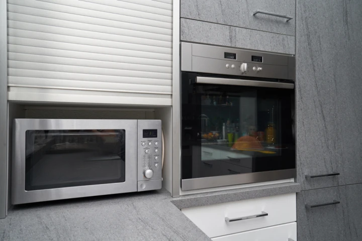 Garage cabinet doors, stainless steel microwave.