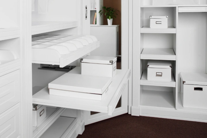 white gliding shelves for built-in closet ideas.