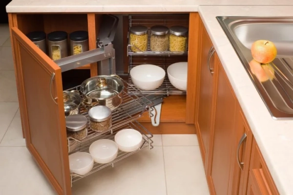 Detail of open kitchen cabinet with cans of beans.