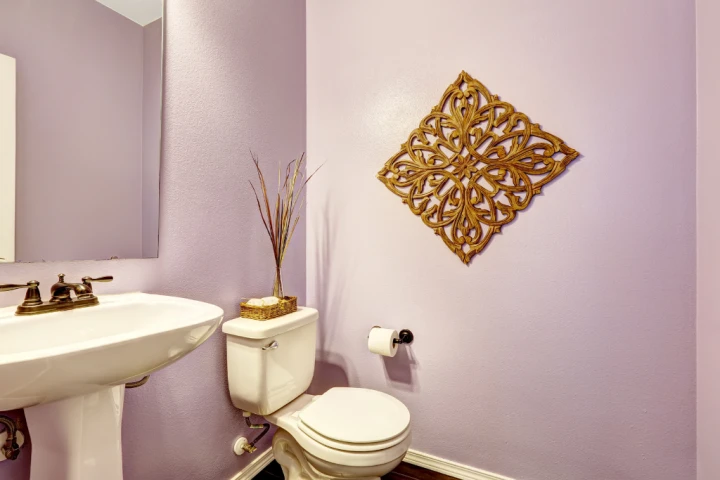 Purple and gold-colored powder room.