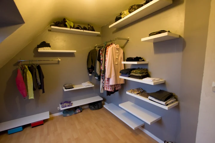 Open-design closet using shelves and rods for kids closet ideas.