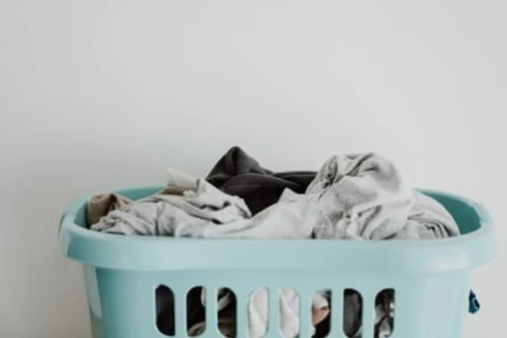 Move laundry basket as part of laundry room storage ideas.