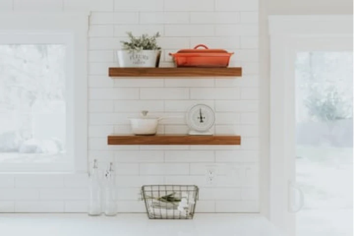 Floating shelves as part of your laundry room storage ideas.