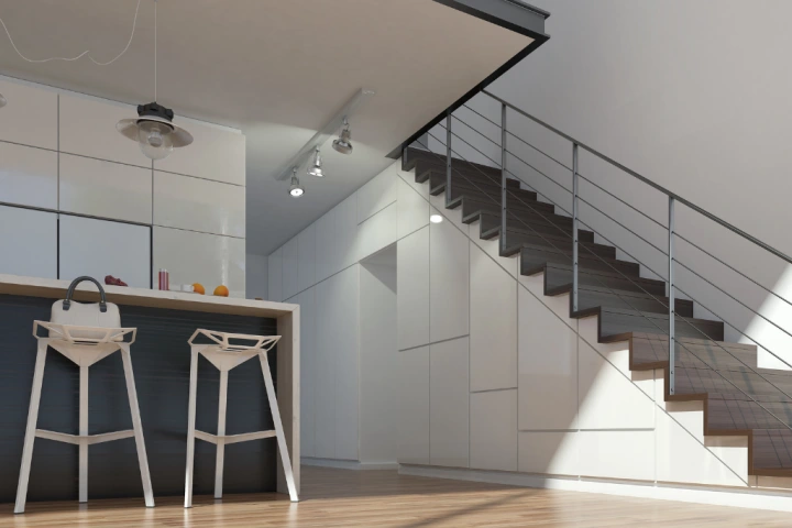 A staircase with a bar stool and a light fixture.