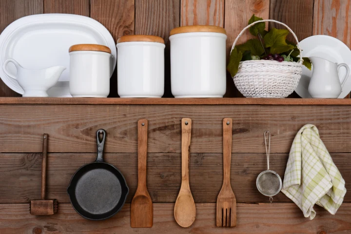 A shelf with utensils and utensils on it.