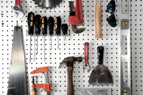 Peg board with tools.