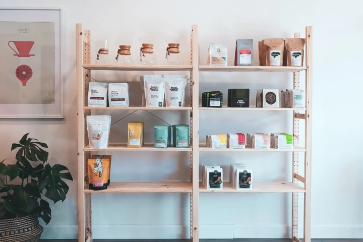 Shelves with different types of coffee on it.