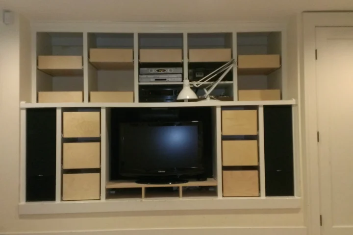 Custom-built shelving is ideal for creating storage around and under a TV.
