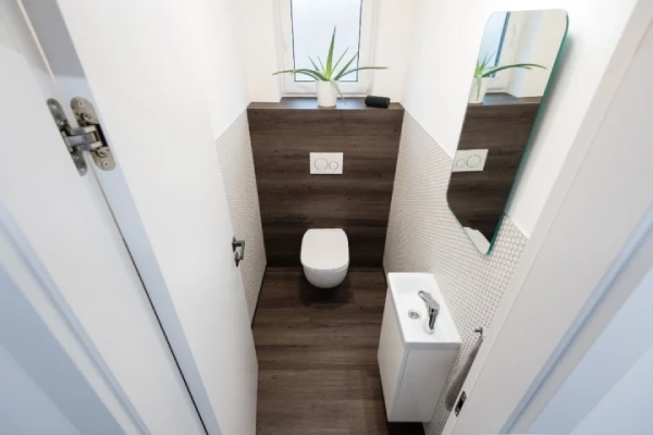 Tiny restroom of contemporary apartment.