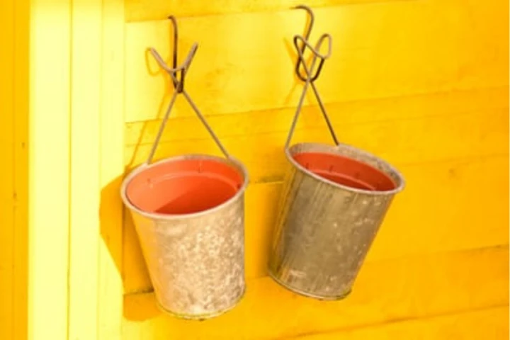 Hanging buckets for toy storage ideas for small spaces.